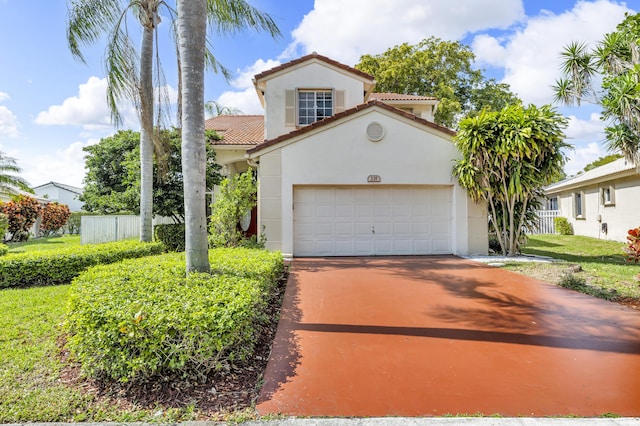 mediterranean / spanish home with stucco siding, an attached garage, fence, driveway, and a tiled roof