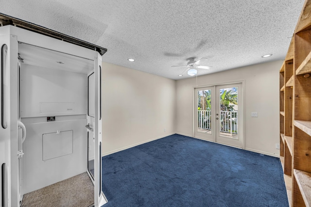 carpeted spare room with a textured ceiling, ceiling fan, french doors, and baseboards