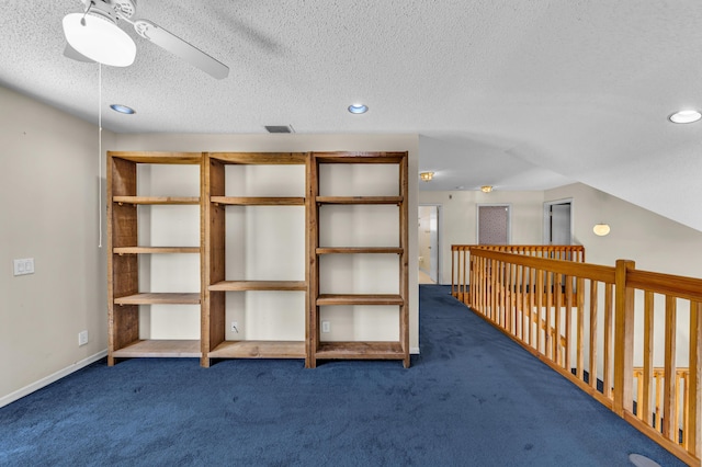 interior space featuring ceiling fan and visible vents