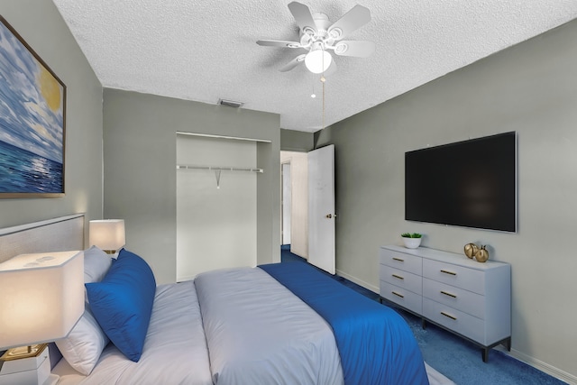 bedroom featuring carpet floors, a closet, visible vents, and a textured ceiling