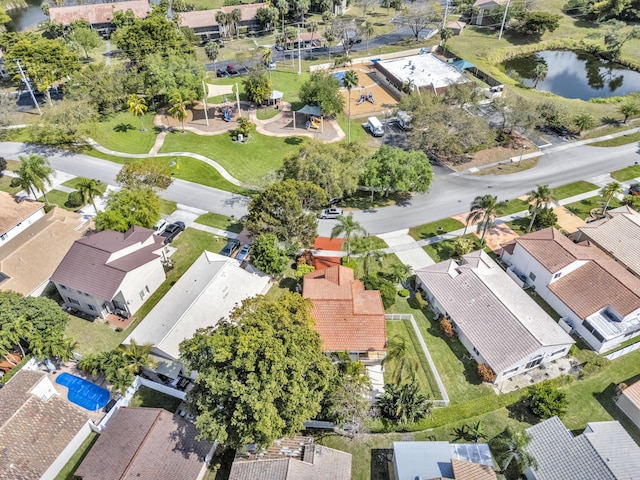 birds eye view of property with a water view and a residential view