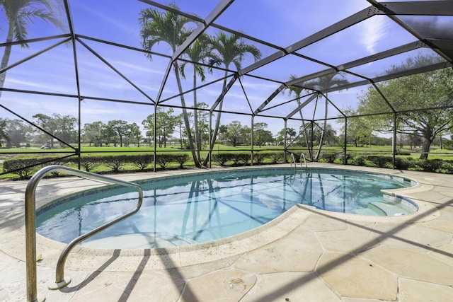 pool with a lanai and a patio