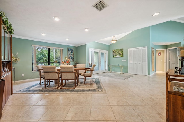 dining space with vaulted ceiling, french doors, visible vents, and crown molding