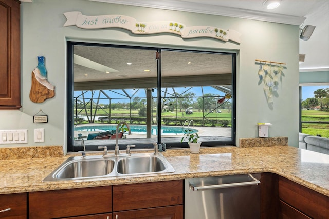 kitchen featuring dishwasher, a sunroom, light stone counters, ornamental molding, and a sink