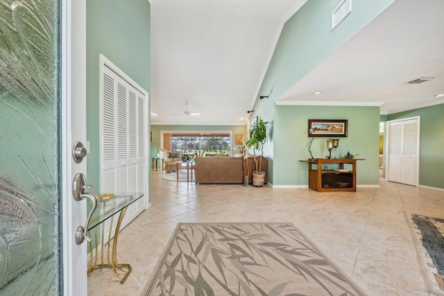 entryway with tile patterned flooring, recessed lighting, visible vents, baseboards, and crown molding