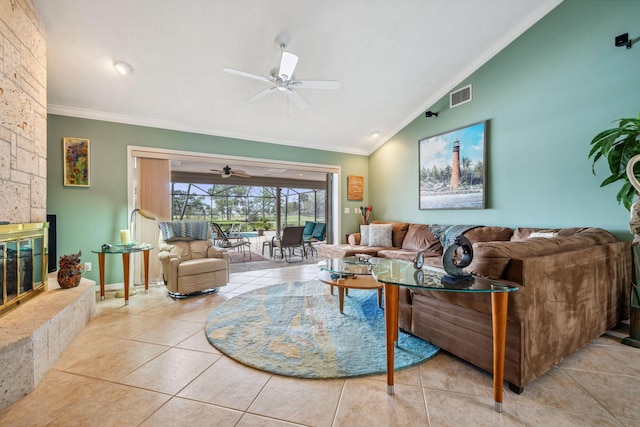 living area featuring a fireplace, visible vents, vaulted ceiling, ornamental molding, and tile patterned floors