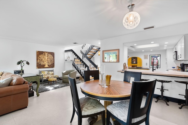 dining room with recessed lighting, visible vents, stairway, and light tile patterned floors