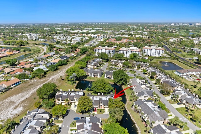 bird's eye view featuring a water view and a residential view