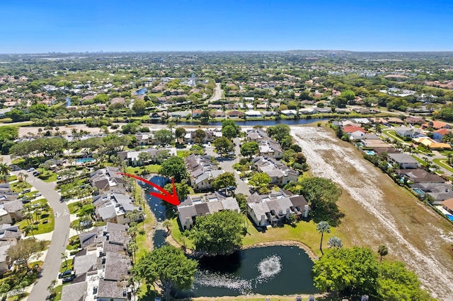 bird's eye view with a water view and a residential view