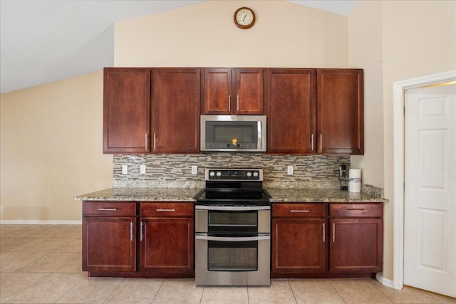 kitchen with baseboards, stone countertops, appliances with stainless steel finishes, and backsplash