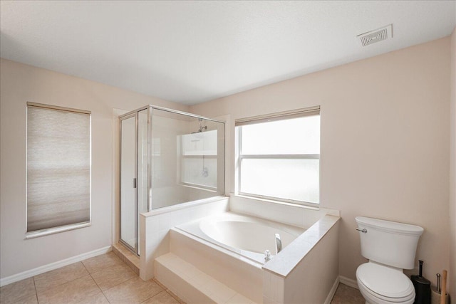 bathroom featuring visible vents, toilet, a shower stall, a bath, and tile patterned floors