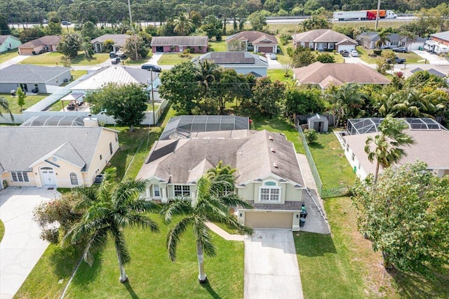 birds eye view of property with a residential view