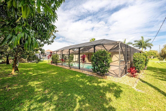 view of yard featuring a lanai and an outdoor pool