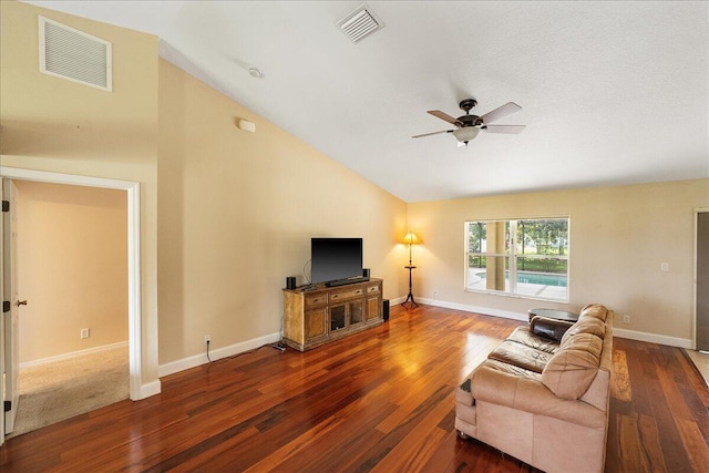 living room with lofted ceiling, wood finished floors, visible vents, and a ceiling fan