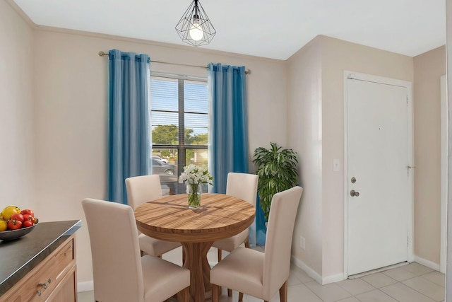 dining room featuring light tile patterned floors and baseboards