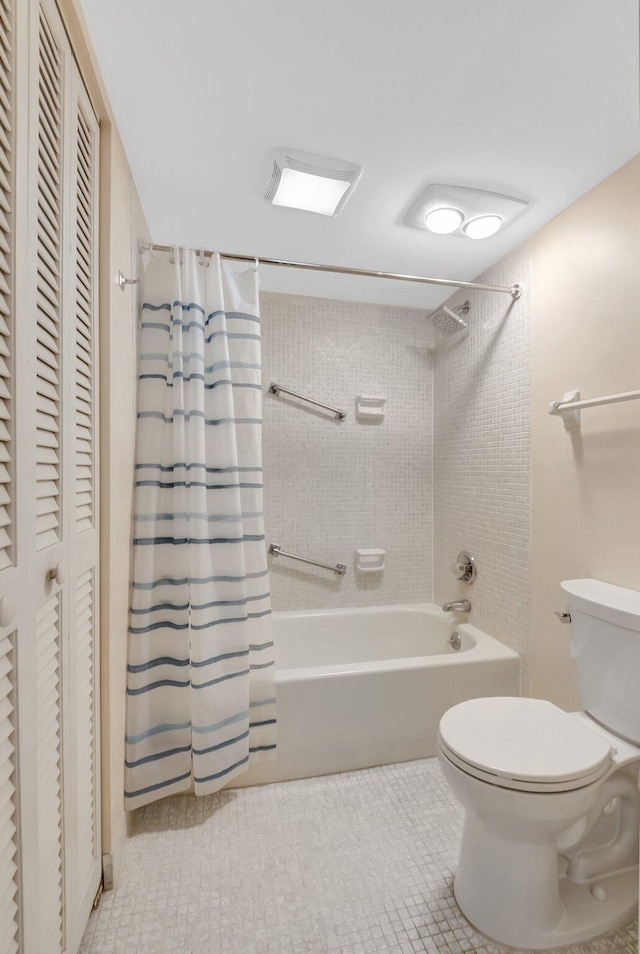 full bath with a closet, tile patterned flooring, toilet, and shower / bathtub combination with curtain