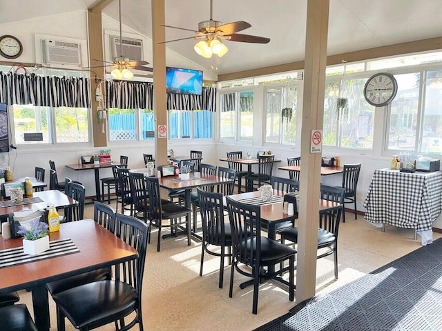 dining room featuring vaulted ceiling, an AC wall unit, and ceiling fan