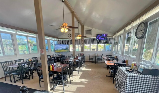 sunroom / solarium featuring visible vents, ceiling fan, and vaulted ceiling