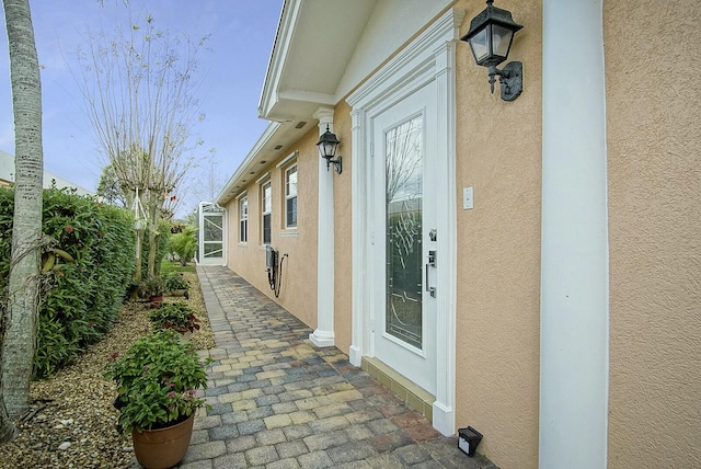 view of side of property featuring stucco siding