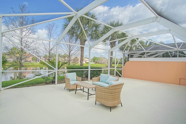 view of patio / terrace with glass enclosure, a water view, and an outdoor living space