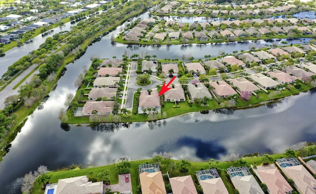 birds eye view of property featuring a residential view and a water view