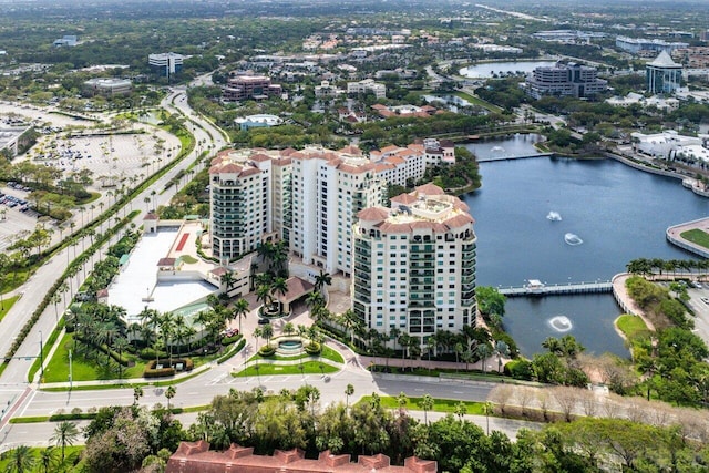 birds eye view of property featuring a water view and a city view