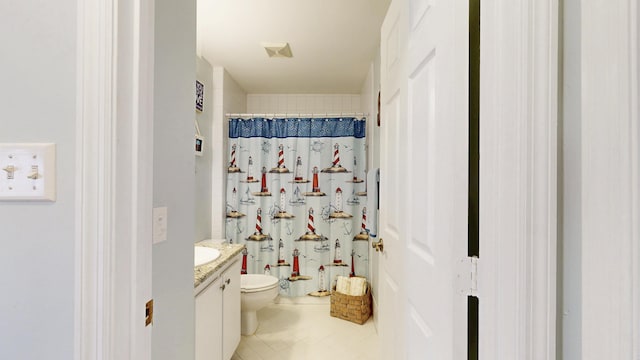 bathroom with visible vents, a shower with shower curtain, toilet, tile patterned floors, and vanity