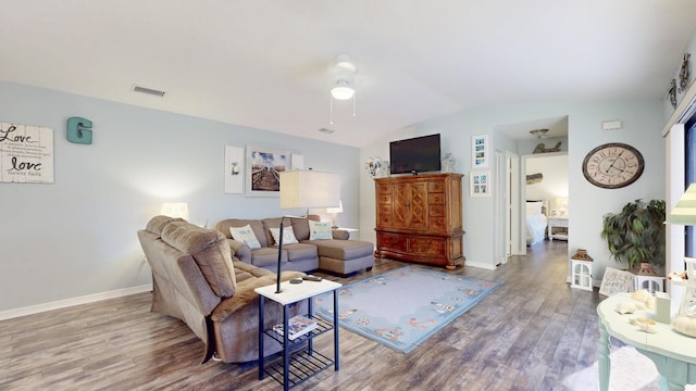 living room with baseboards, visible vents, vaulted ceiling, and wood finished floors