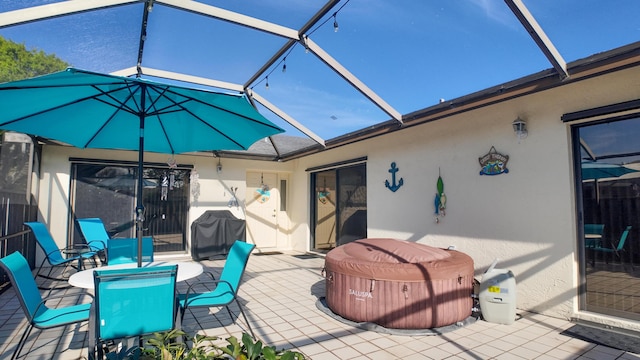 view of patio featuring a lanai and grilling area