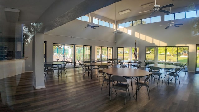 dining area with dark wood-style floors and baseboards