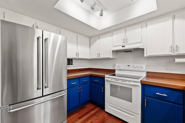 kitchen with blue cabinets, high quality fridge, white range with electric cooktop, and under cabinet range hood