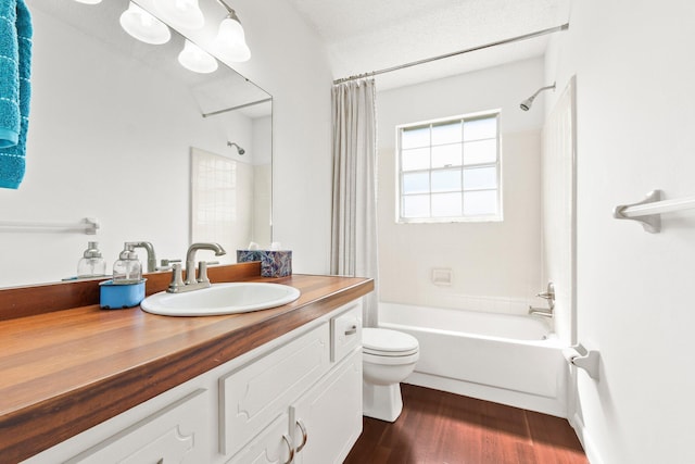 full bathroom featuring toilet, vanity, shower / tub combo with curtain, and wood finished floors