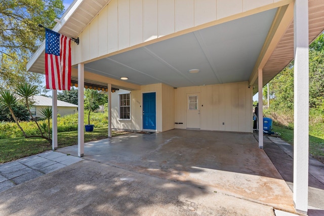 view of patio featuring a carport and driveway