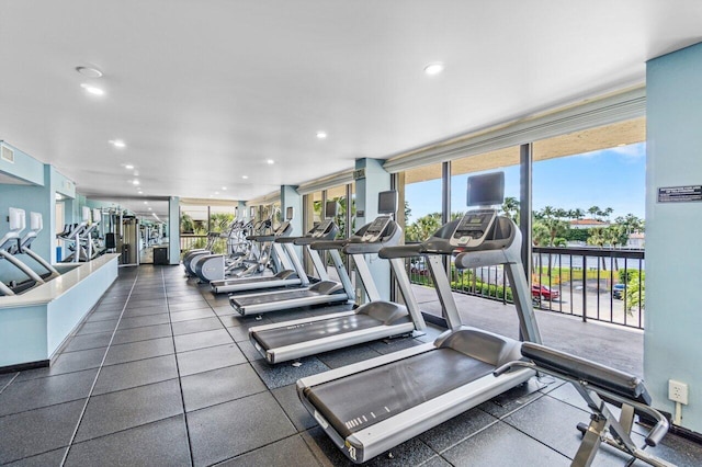 exercise room with recessed lighting, floor to ceiling windows, and visible vents