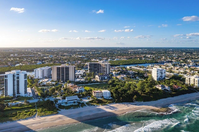 birds eye view of property with a view of city and a water view