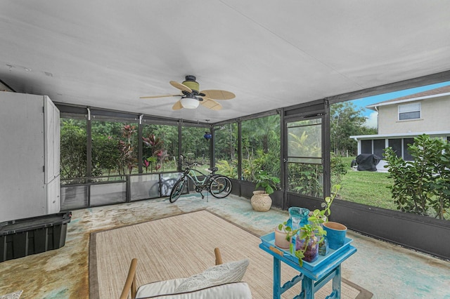 sunroom featuring a wealth of natural light and ceiling fan