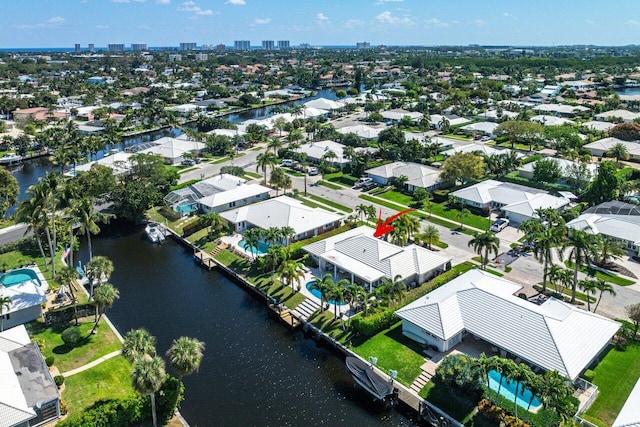 birds eye view of property featuring a residential view and a water view