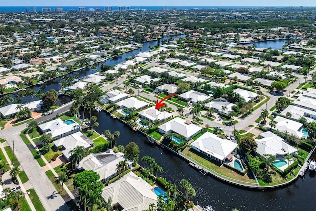 birds eye view of property featuring a residential view and a water view