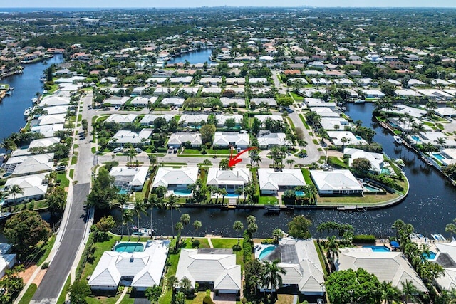 birds eye view of property with a residential view and a water view