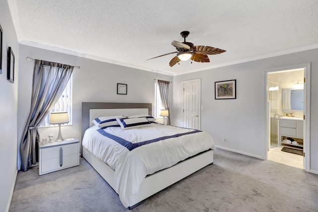 carpeted bedroom featuring crown molding, a ceiling fan, a textured ceiling, and a sink