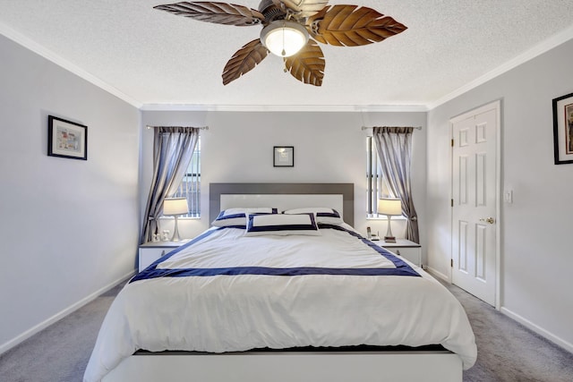 carpeted bedroom featuring baseboards, ornamental molding, a ceiling fan, and a textured ceiling