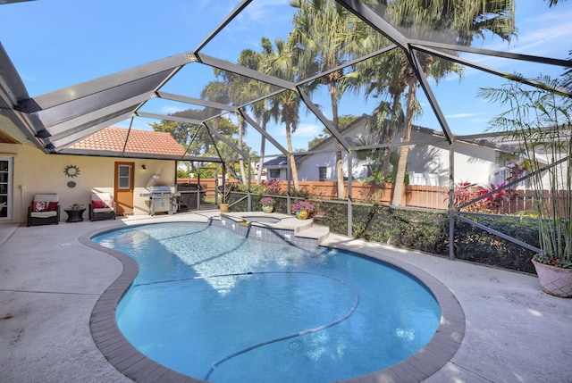 view of pool featuring fence, a patio, grilling area, and glass enclosure