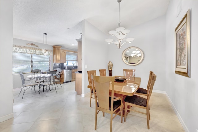 dining area with baseboards and a notable chandelier