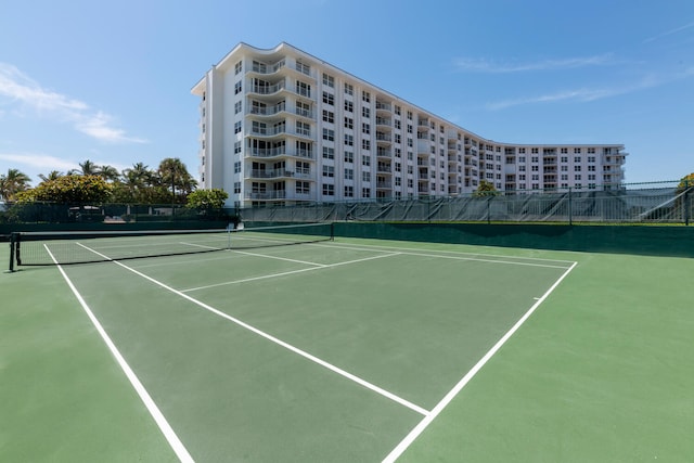 view of tennis court with fence