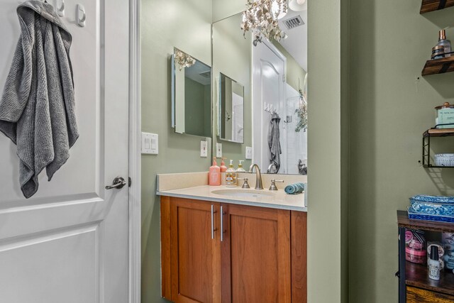 bathroom with visible vents and vanity