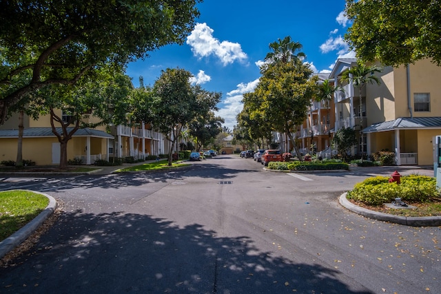 view of road with curbs and a residential view