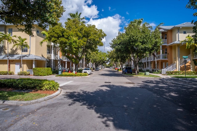 view of road with curbs and a residential view