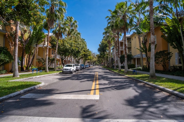 view of street featuring curbs, sidewalks, and a residential view