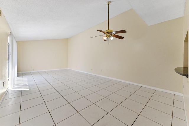 unfurnished room featuring light tile patterned floors, baseboards, a textured ceiling, and a ceiling fan