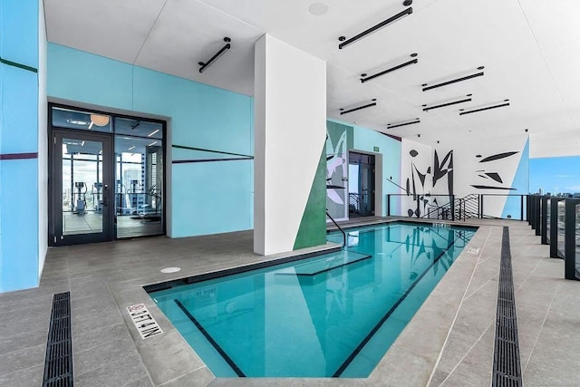 community pool featuring french doors